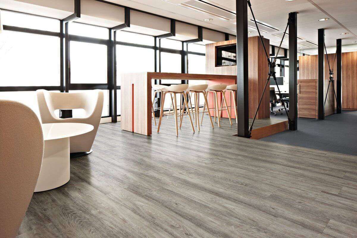 A modern office with a bar and chairs