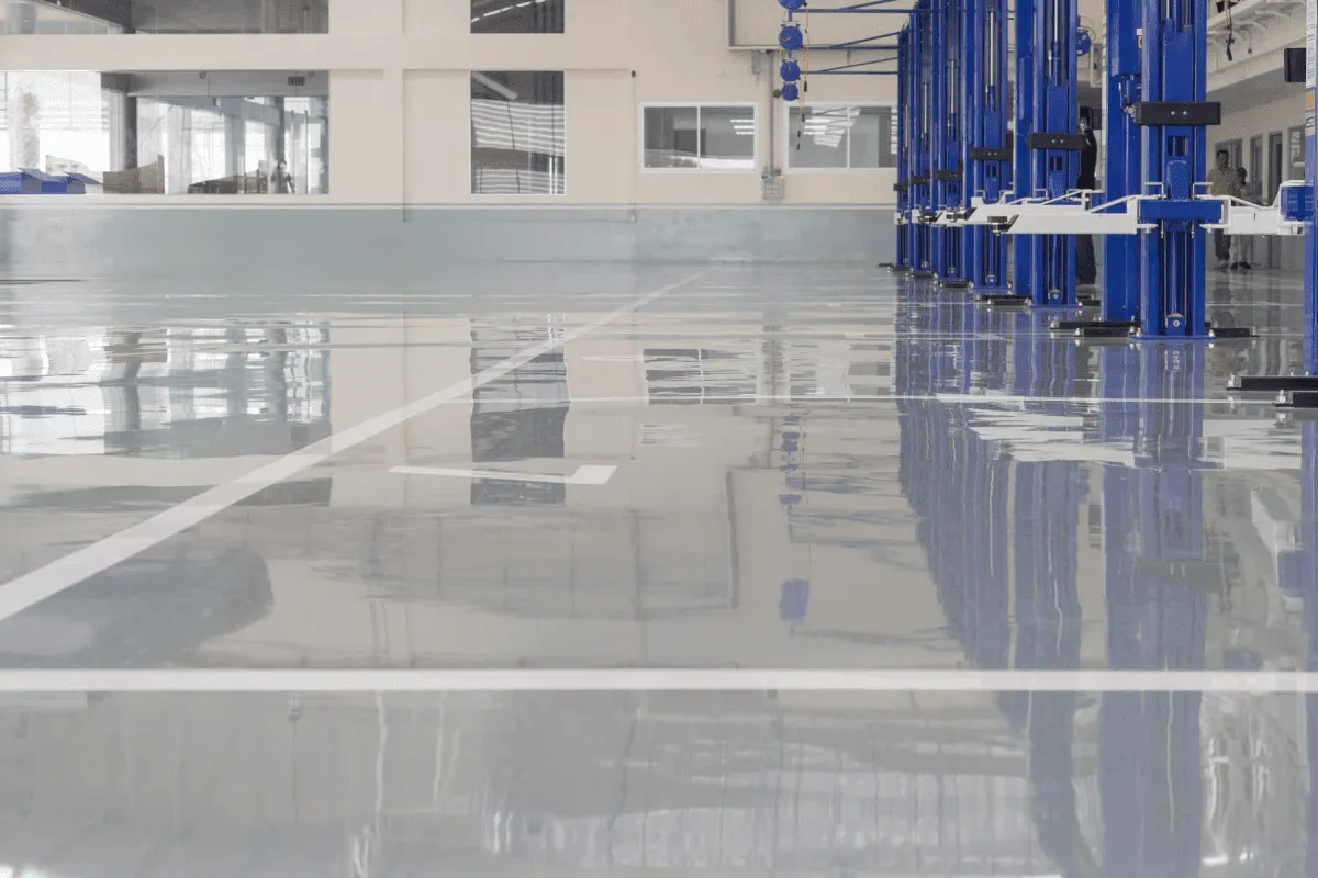 A building with a shiny floor and blue and white columns