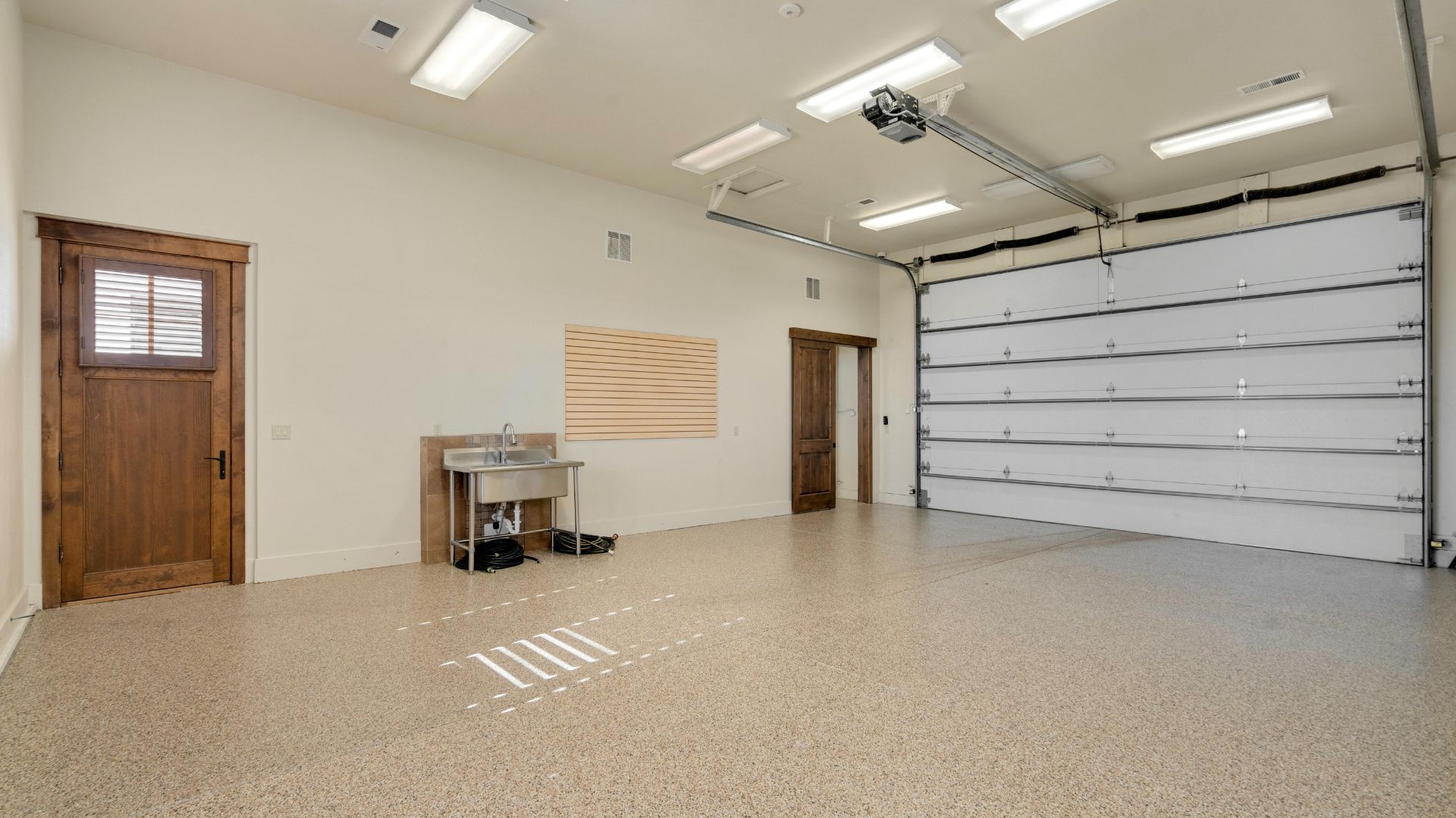 A garage with a table and a sink in it