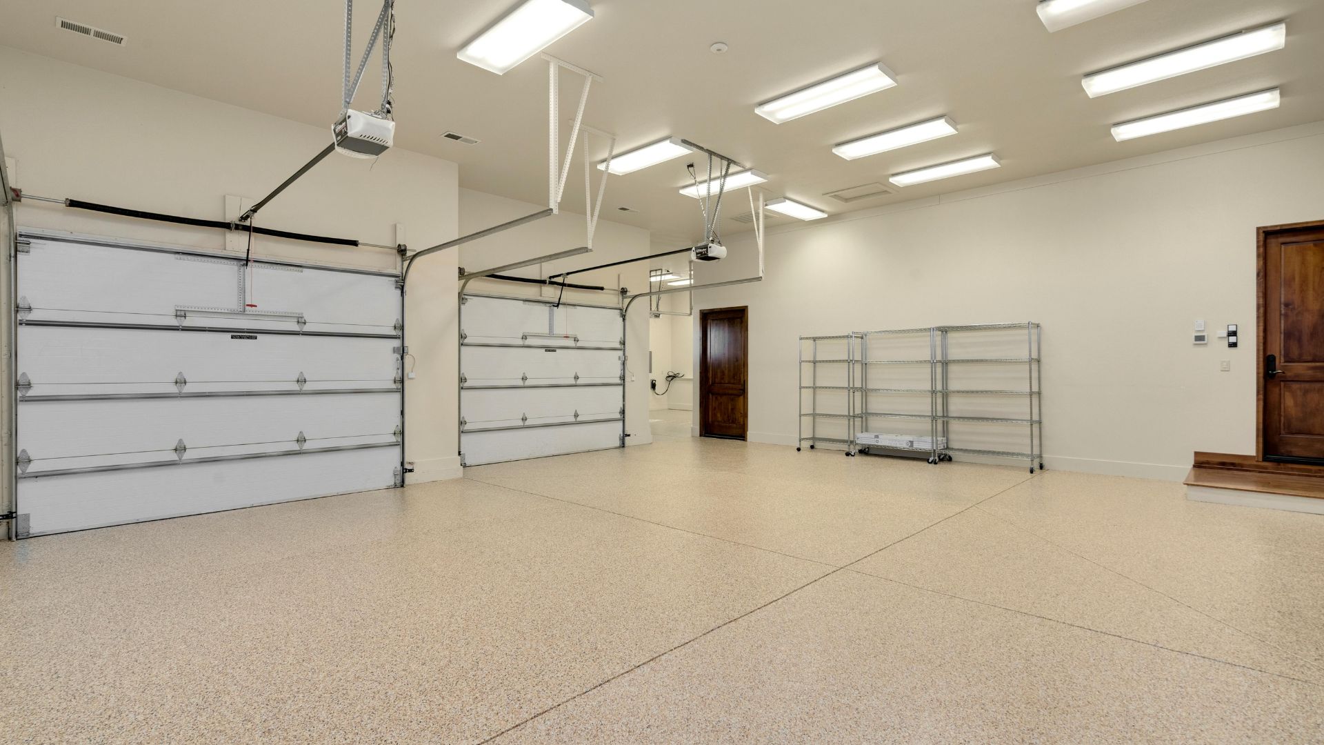 A large empty room with a bunch of garage doors