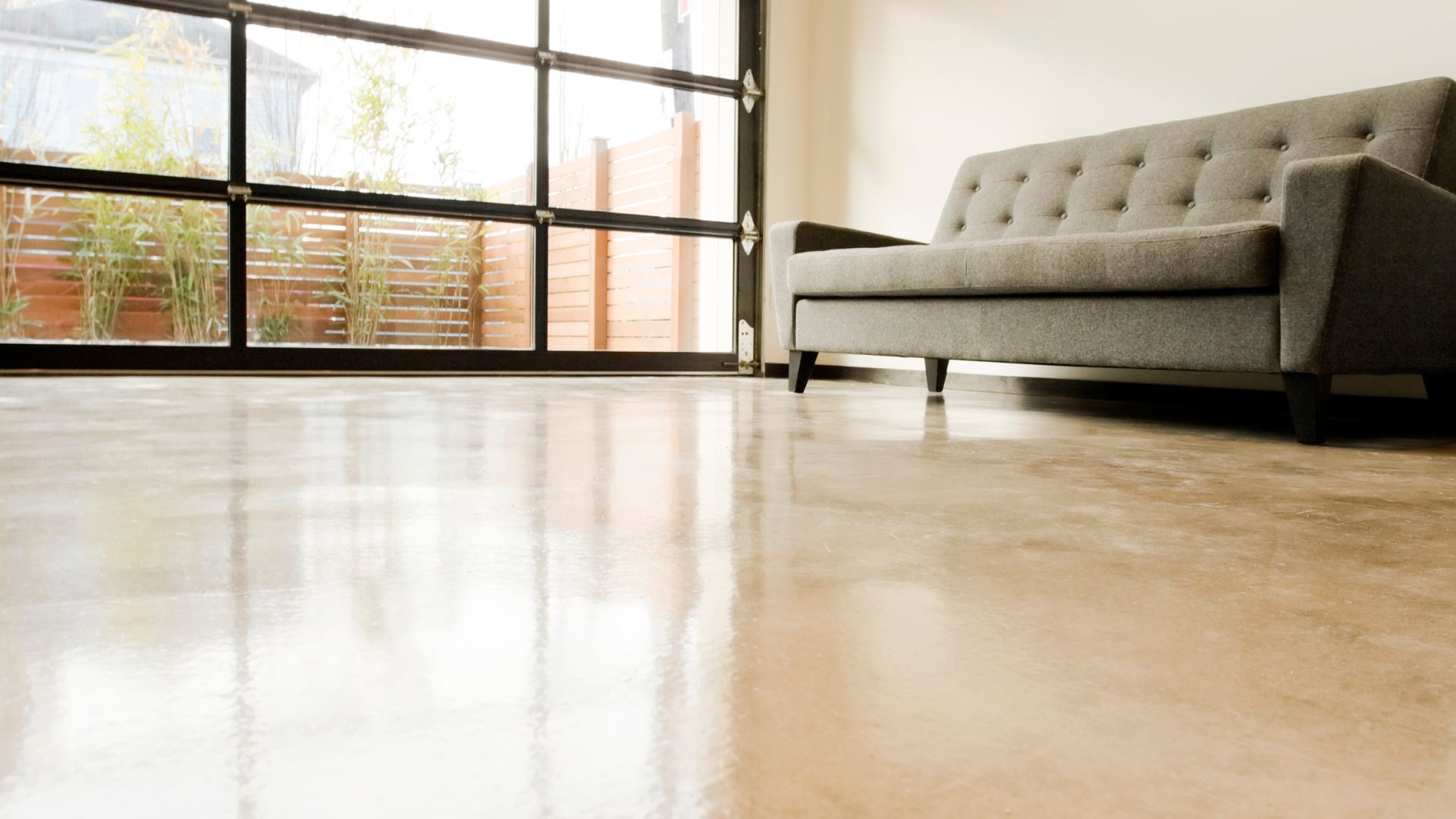 A couch sitting on top of a hard wood floor